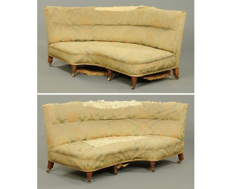 A pair of Victorian settees, of shaped outline, each raised on three well turned front legs, with three splayed rear legs and