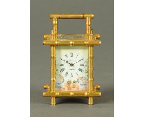 A brass carriage clock, with simulated bamboo style case and porcelain dial marked "Elliott & Son, London".  Height 11.5 cm. 