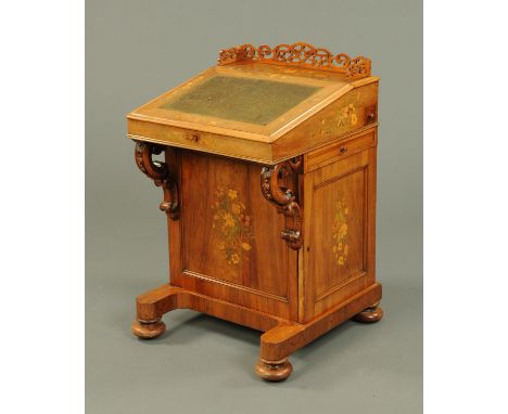 A Victorian floral marquetry Davenport desk, with slope front, slide, panelled cupboard door enclosing shelves and raised on 