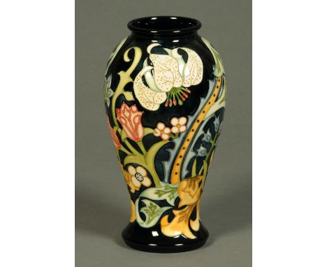 A Moorcroft vase, of baluster form, relief moulded, impressed "Moorcroft, Made in England" and with green "WM" initials.  Hei