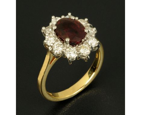 An 18 ct yellow gold Taiwanese ruby and diamond cluster ring, ruby 2.03 carats, diamond weight .74 carats, size M/N.