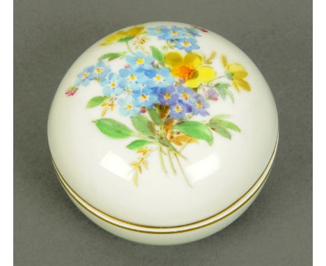 A Meissen lidded trinket box, second quality, foliate design to lid, blue crossed swords mark.  Diameter 75 mm. 
