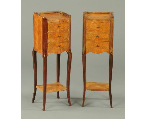 A pair of French kingwood bedside cabinets, of narrow form, with galleried top, three frieze drawers, low shelf and cabriole 