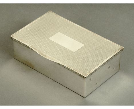 A silver table cigarette box, Sheffield 1968.  Length 14.7 cm.  CONDITION REPORT: The cigarette box is in first class conditi