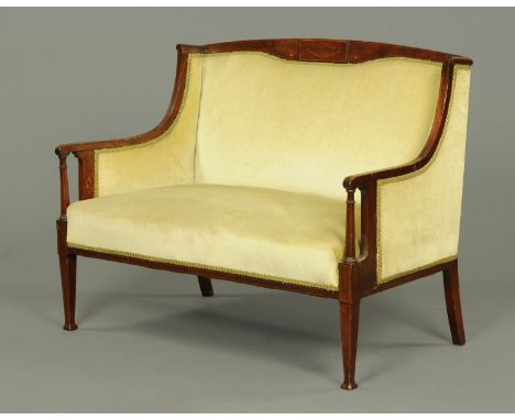 An Edwardian inlaid mahogany settee, upholstered in green velvet type material and raised on tapered legs of square section. 