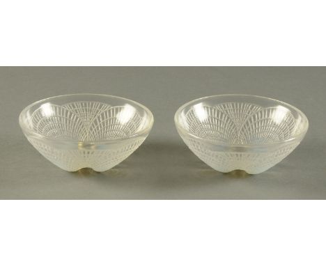 A pair of Lalique Coquilles small bowls, etched "R. Lalique, France".  Diameter 13.5 cm.  CONDITION REPORT: These are both in