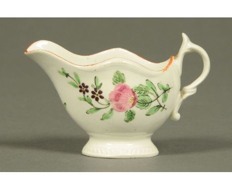 A Worcester butter boat, polychrome, decorated with flowers.  Length 9.5 cm.  CONDITION REPORT: There is a hairline crack acr