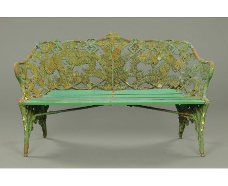 A Coalbrookdale style fern patterned garden bench, green painted and with wooden slats.  Width 156 cm (see illustration).