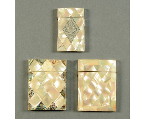 Three Victorian mother of pearl card cases, the smallest with silver coloured metal diamond shape cartouche.  Largest 75 mm x