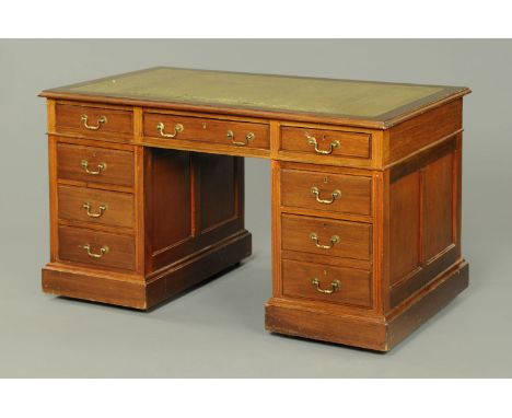 A mahogany pedestal desk, bearing label "George D. Pooley, 4 Great Queen Street, Kingsway", fitted with a series of frieze dr