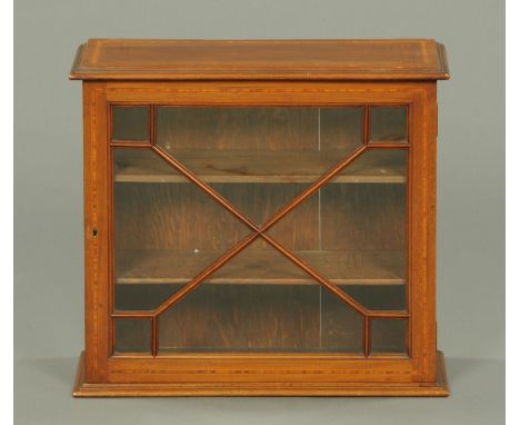 An Edwardian inlaid mahogany hanging cabinet, rectangular, being satinwood banded, boxwood and ebony strung and with glazed d