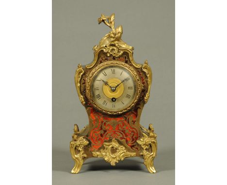 A 19th century French boulle marquetry mantle clock, with single-train movement and silvered dial.  Height 30 cm.  CONDITION 