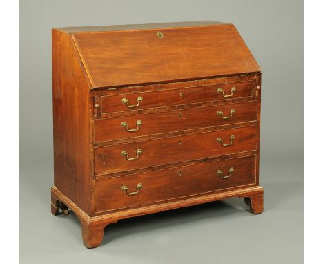 A George III mahogany bureau, with slope front, fitted interior and four long graduated drawers with brass swans neck drop ha
