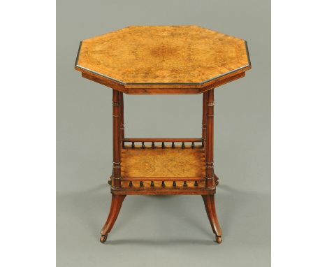 A Victorian walnut octagonal occasional table, inlaid and crossbanded and raised on turned and fluted supports with low shelf