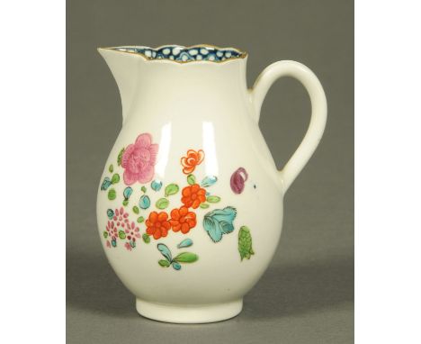 A Worcester sparrow beak jug, polychrome, decorated with flowers and with blue internal lip border, crescent mark.  Height 9 
