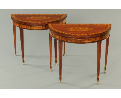 A pair of Killarney style demi-lune card tables, profusely decorated with penwork, shamrocks and Muckross Abbey, with green b
