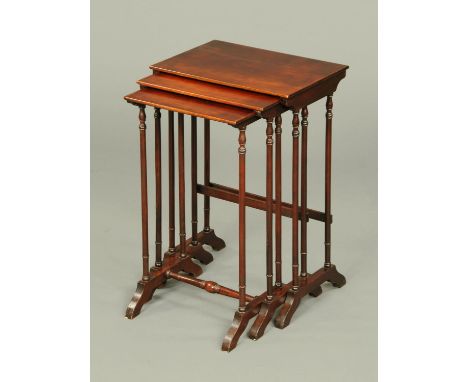 A 19th century mahogany nest of tables, with turned supports and centre stretcher to the smallest table.  Width 48.5 cm.  CON