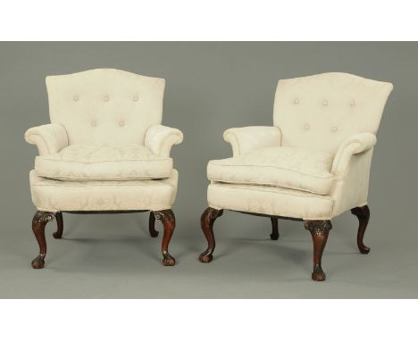 A pair of Queen Anne style mahogany and upholstered armchairs, upholstered in pale blue foliate patterned material and raised