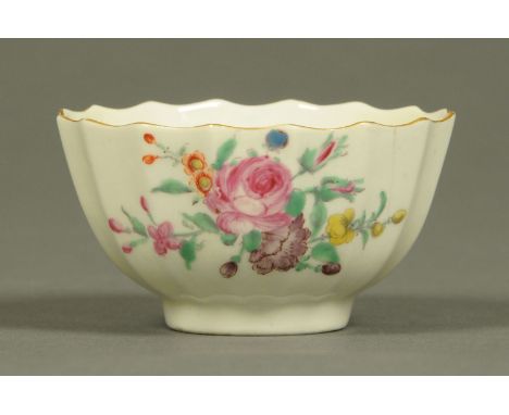 A Worcester fluted tea bowl, polychrome, decorated with floral bouquet and sprigs.
