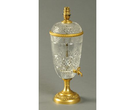 A cut glass and brass table lamp, with pink shade.  Overall height 72 cm. 