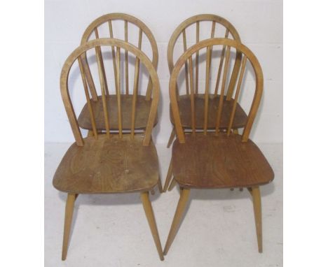 Four vintage (1978) Ercol Windsor stick back chairs.