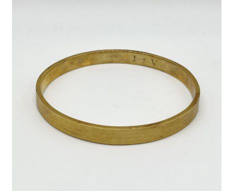 A large 9ct gold slave bangle, weight 15.5g