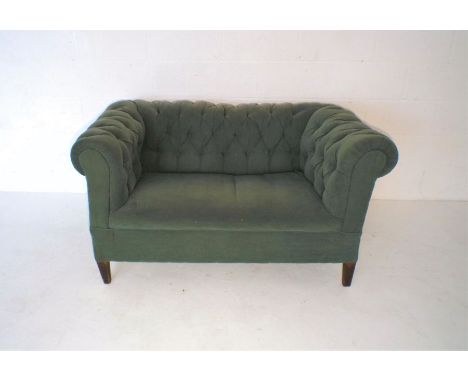 A small green Chesterfield sofa, approximate length 142cm.