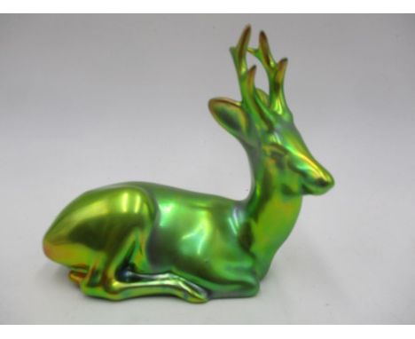 A Zsolnay Pecs figure of a recumbent stag with blue-green eosin glaze, signed Linko Q (scratch to right ear) height 11.5cm