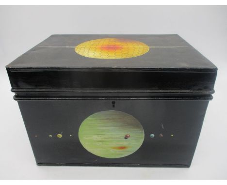 A small tin trunk, decorated with planetary designs. 33cm x 24cm, height 23cm