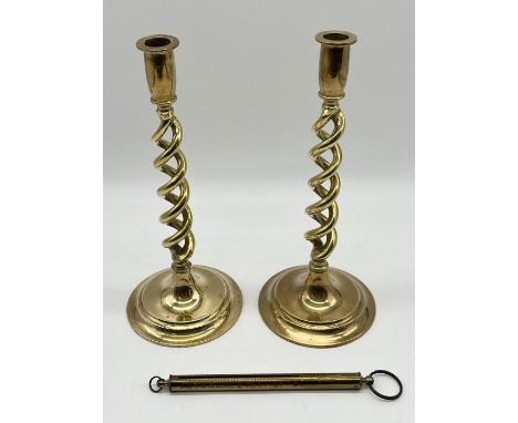 A pair of barley twist brass candlesticks along with a set of broad arrow stamped Salter scale marked 1953