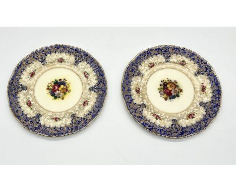 A pair of Royal Worcester hand painted cabinet plates with gilt and floral design, retailed by Marshall Field &amp; Company C