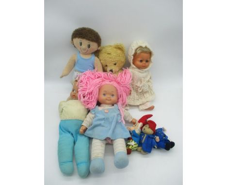 A collection of vintage baby dolls, soft toys and teddy bear