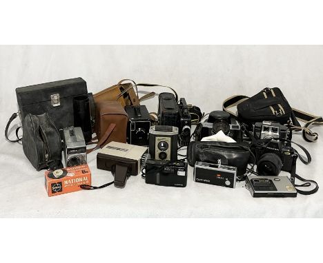 A collection of vintage cameras including Kodak, Minolta etc. 