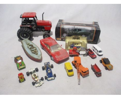 A collection of various die-cast including a boxed Maisto Jaguar XK8 (1:18 scale), large International Case 2594 tractor, one