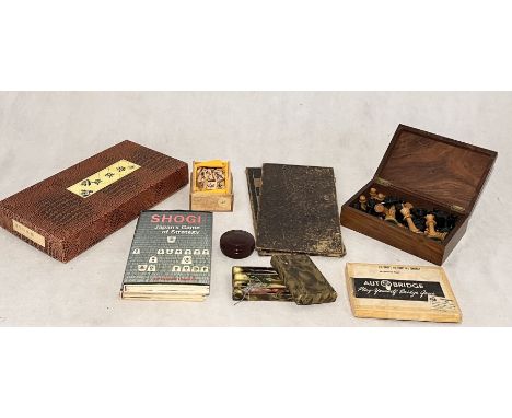 A collection of vintage games including wooden chess set (some pieces A/F) and a Shogi board, counters and books relating to 