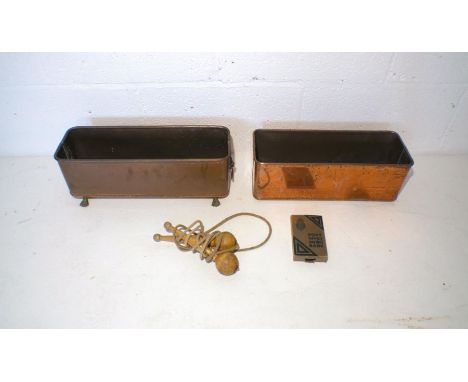 Two copper planters along with a vintage skipping rod and a Post Office Savings Bank tin.