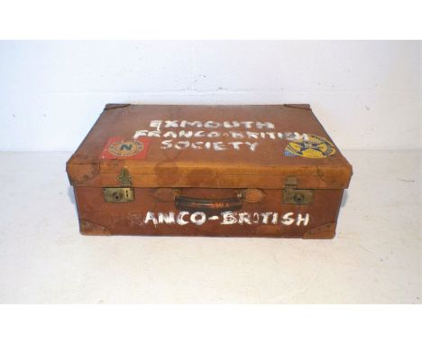 A vintage leather suitcase, marked 'Pritchard Preston'.