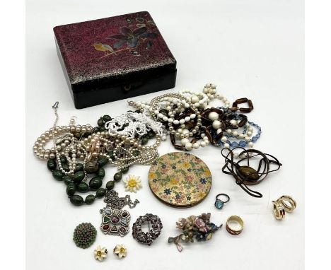 A collection of costume jewellery, compact etc.