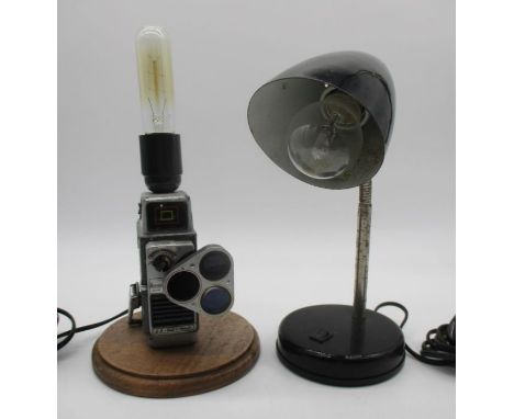 A steampunk lamp incorporating a vintage cine camera, plus one more lamp.