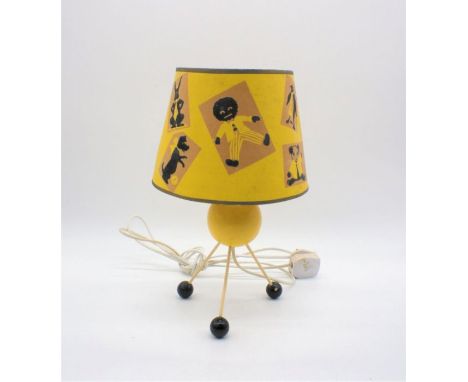 A vintage atomic table lamp with children's shade