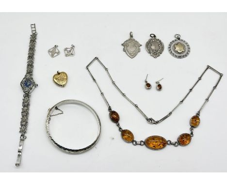 A collection of 925 silver jewellery, bangle, medallions, amber necklace, cocktail watch along with a rolled gold locket