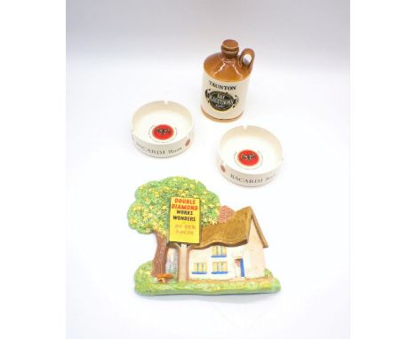 A Taunton Dry Blackthorn Cider novelty ceramic jug along with two Crown Devon Bacardi Rum ashtrays and a Beswick Double Diamo