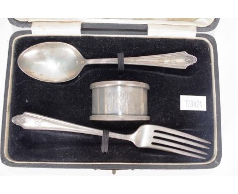 Cased sterling silver three piece baptism set including spoon and fork marked for Birmingham 1932/3, together with napkin rin