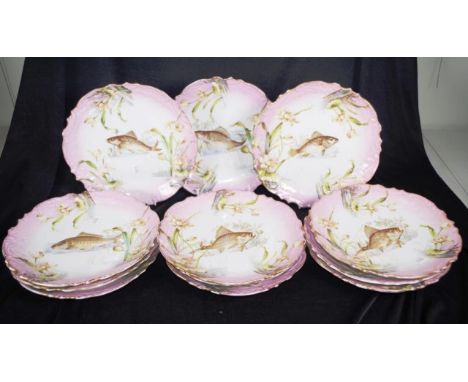 Vintage set twelve Limoges ceramic fish plates fish decoration to each plate, (diameter 22.5cm approx, each).