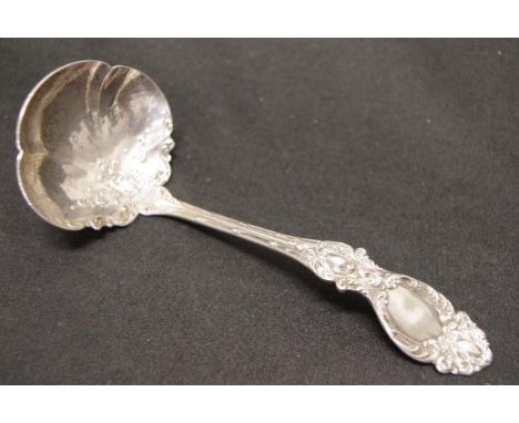 USA  Robert Wallace sterling sauce ladle marked to handle, embossed decoration to handle and bowl, (length 17cm, weight 84gra