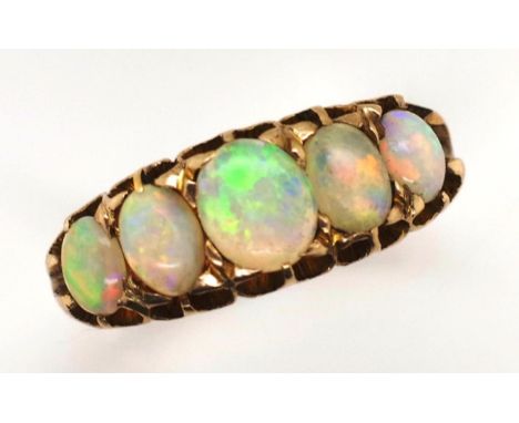 Antique 12ct gold and five stone opal ring marked 12ct twice. Approx 3.2mm x 4.3mm - 4.5mm x 5.8mm cabochon opals. With nice 