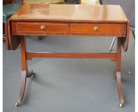 Regency style sofa table with 2 drawer fronts to one side and drawer fronts to the other, 93cm wide (closed), 61cm deep, 76cm