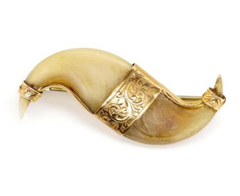 Antique 9ct gold and tigers claw brooch marked 9ct. This item cannot be exported.