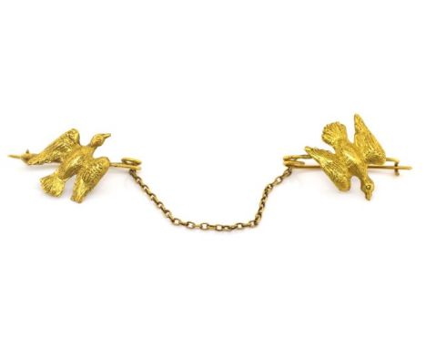 Bird form cloak fastener decorated with two dove figures approx 12cm length. 4 grams weight With gilt metal and 18ct gold par
