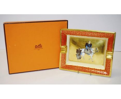 Hermes France ceramic ashtray decorated with a scene of Japanese figures on horseback, gilt highlights, marked to base, in or